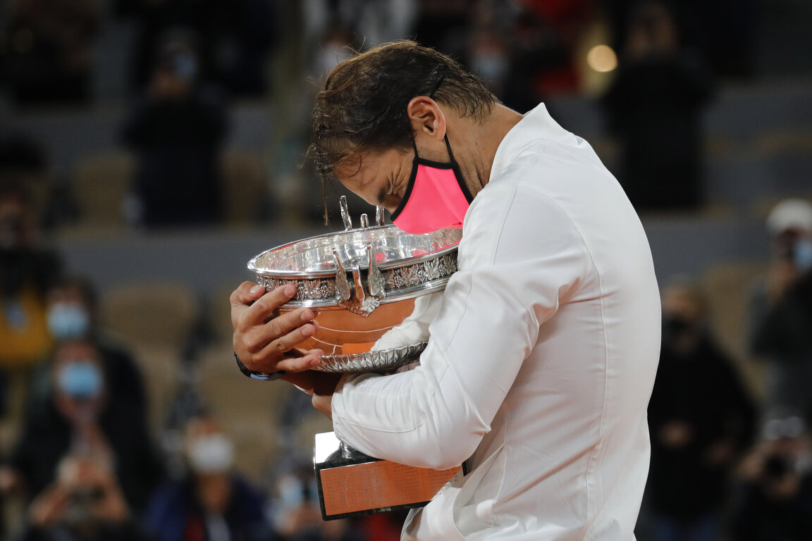 Spain's Rafael Nadal holds the trophy as he celebrates winning the final match of the French Open tennis tournament against Serbia's Novak Djokovic in three sets, 6-0, 6-2, 7-5, at the Roland Garros stadium in Paris, France, Sunday, Oct. 11, 2020. (