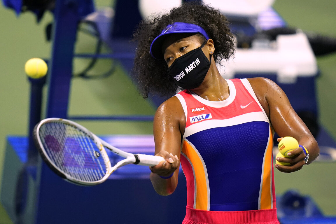  Naomi Osaka, of Japan, hits balls into the stands after defeating Anett Kontaveit, of Estonia, during the fourth round of the US Open tennis championships, Monday, Sept. 7, 2020, in New York. (AP Photo/Frank Franklin II) 