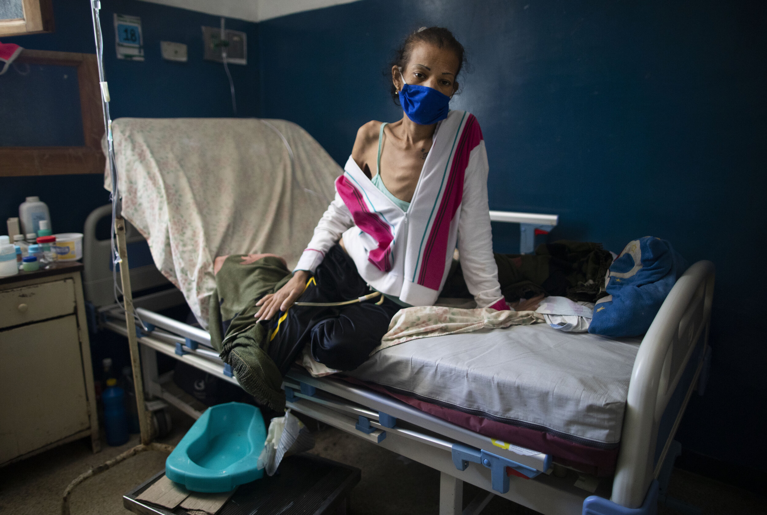  Yalitza Cadiz, who is being treated for cervical cancer, sits on her bed at the Luis Razetti hospital in Caracas, Venezuela, Tuesday, Sept 2, 2020. Consultations with new cancer patients have been suspended due to lack of water, air conditioning, su