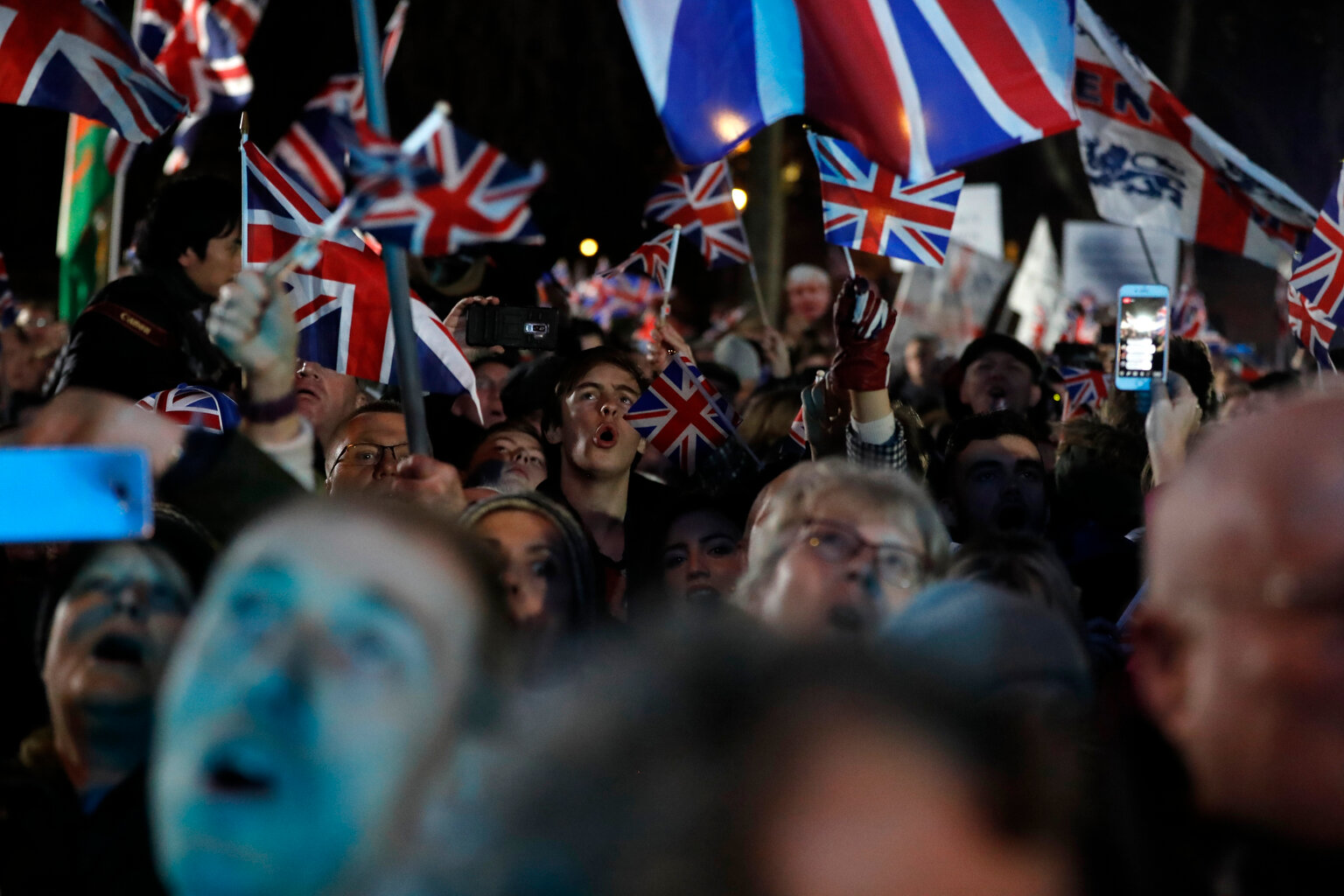  Brexit supporters celebrate during a rally in London, Friday, Jan. 31, 2020. Britain leaves the European Union after 47 years, leaping into an unknown future in historic blow to the bloc. (AP Photo/Frank Augstein) 