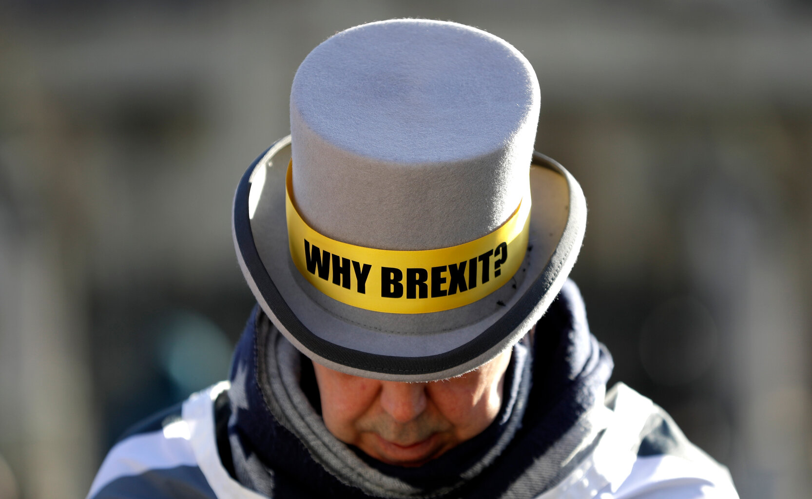  Why Brexit? written on the hat of Anti-Brexit campaigner Steve Bray as he stands outside Parliament in London, Wednesday, Jan. 29, 2020. (AP Photo/Kirsty Wigglesworth) 