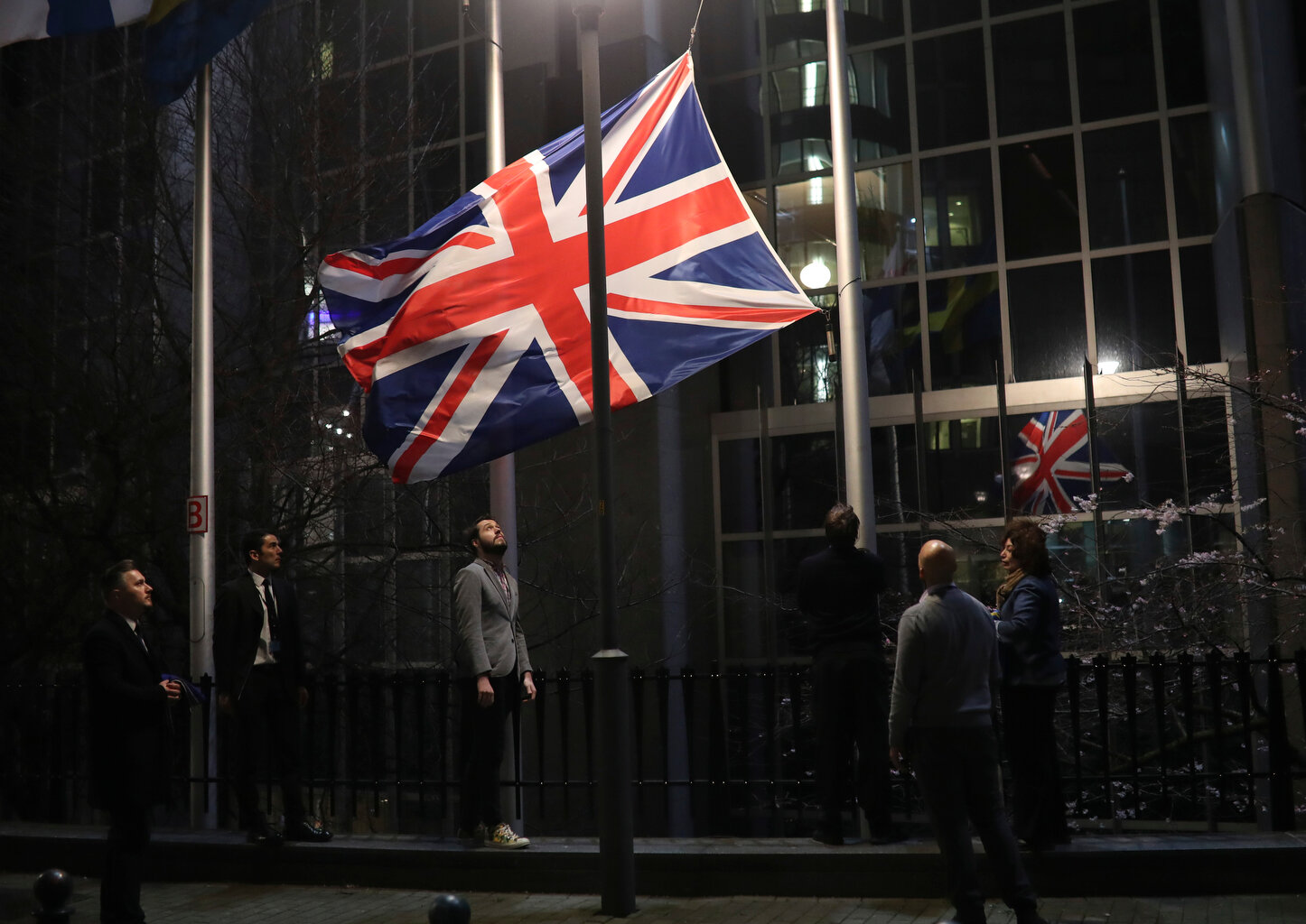  The Union flag is lowered and removed from outside of the European Parliament in Brussels, Friday, Jan. 31, 2020. (AP Photo/Francisco Seco) 