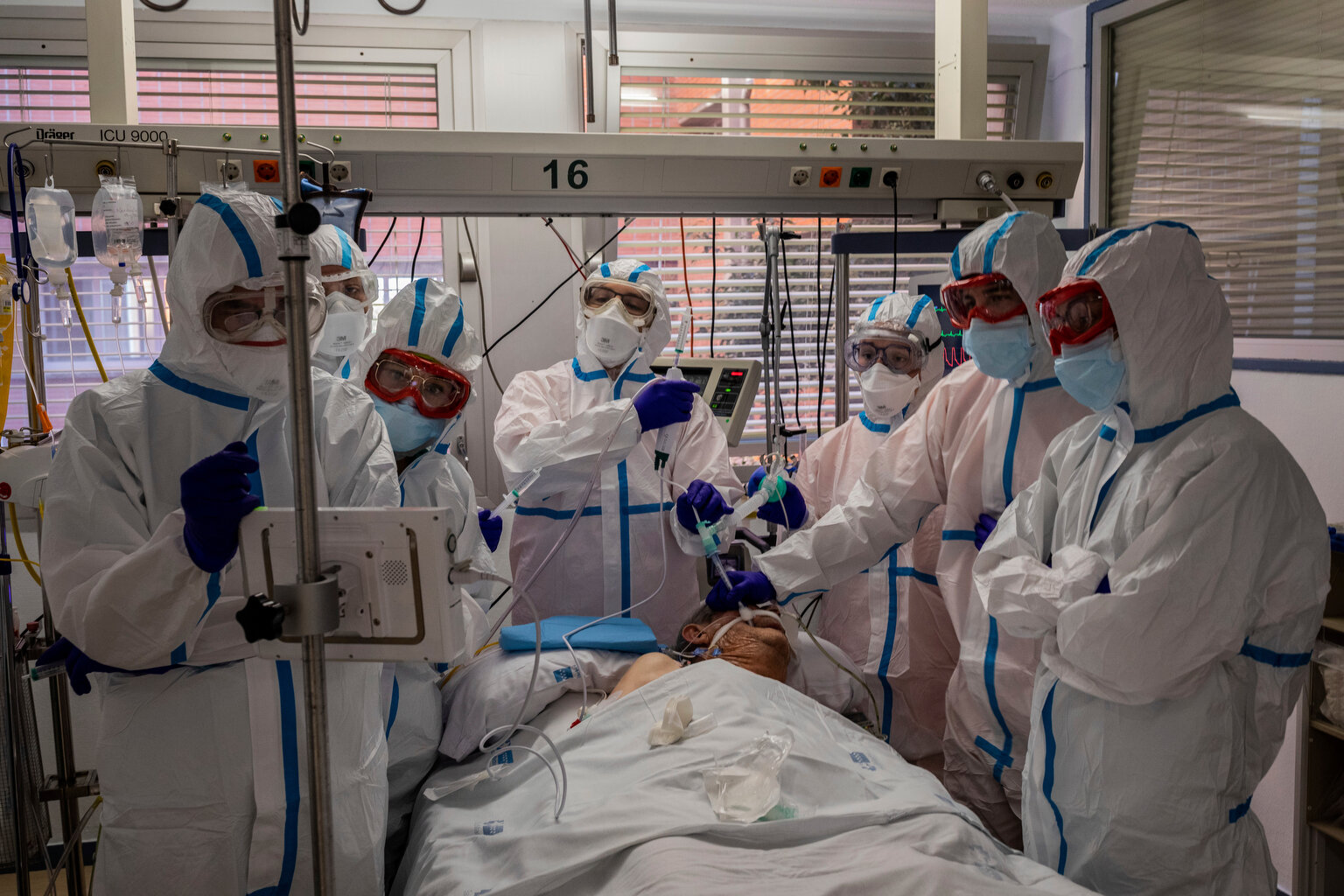  A patient infected with COVID-19 is treated in one of the intensive care units (ICU) at the Severo Ochoa hospital in Leganes, outskirts of Madrid, Spain, Friday, Oct. 9, 2020. (AP Photo/Bernat Armangue) 