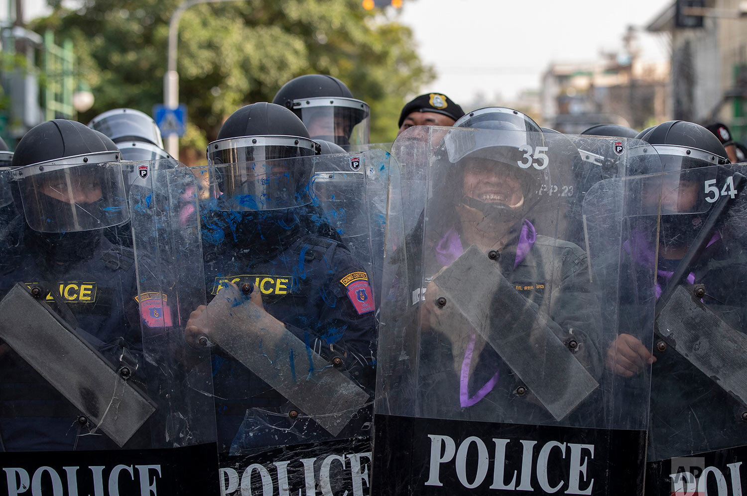  Police in riot gear stand guard as they face pro-democracy protesters during a rally Thursday, Dec. 10, 2020 in Bangkok, Thailand.  (AP Photo/Gemunu Amarasinghe) 