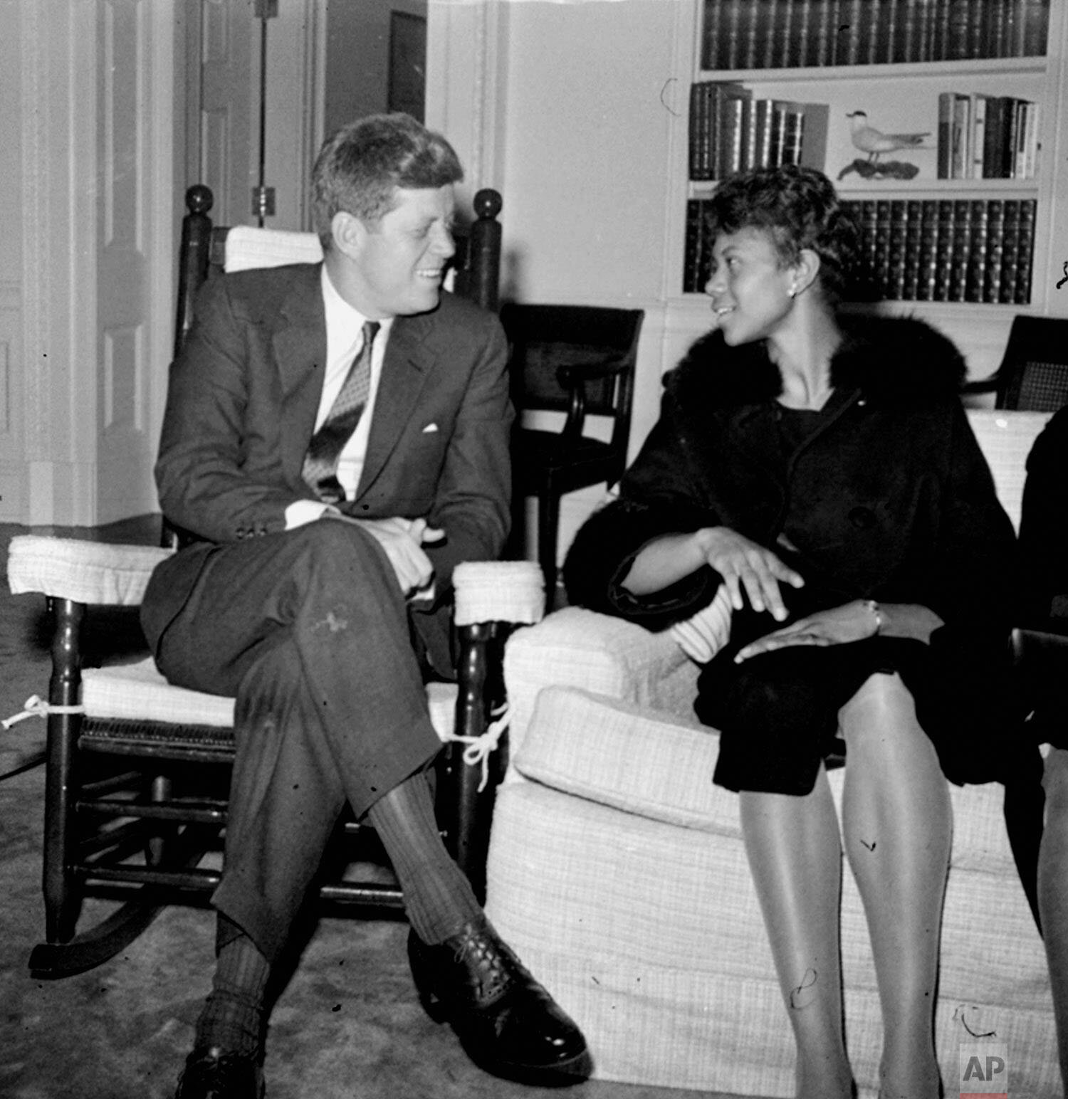  President John F. Kennedy chats in his White House office April 14, 1961, with Wilma Rudolph, winner of three gold medals in the 1960 Olympic games.  Wilma, a student at Tennessee State, won the 100- and 200-meter races in Rome and was the anchor ru