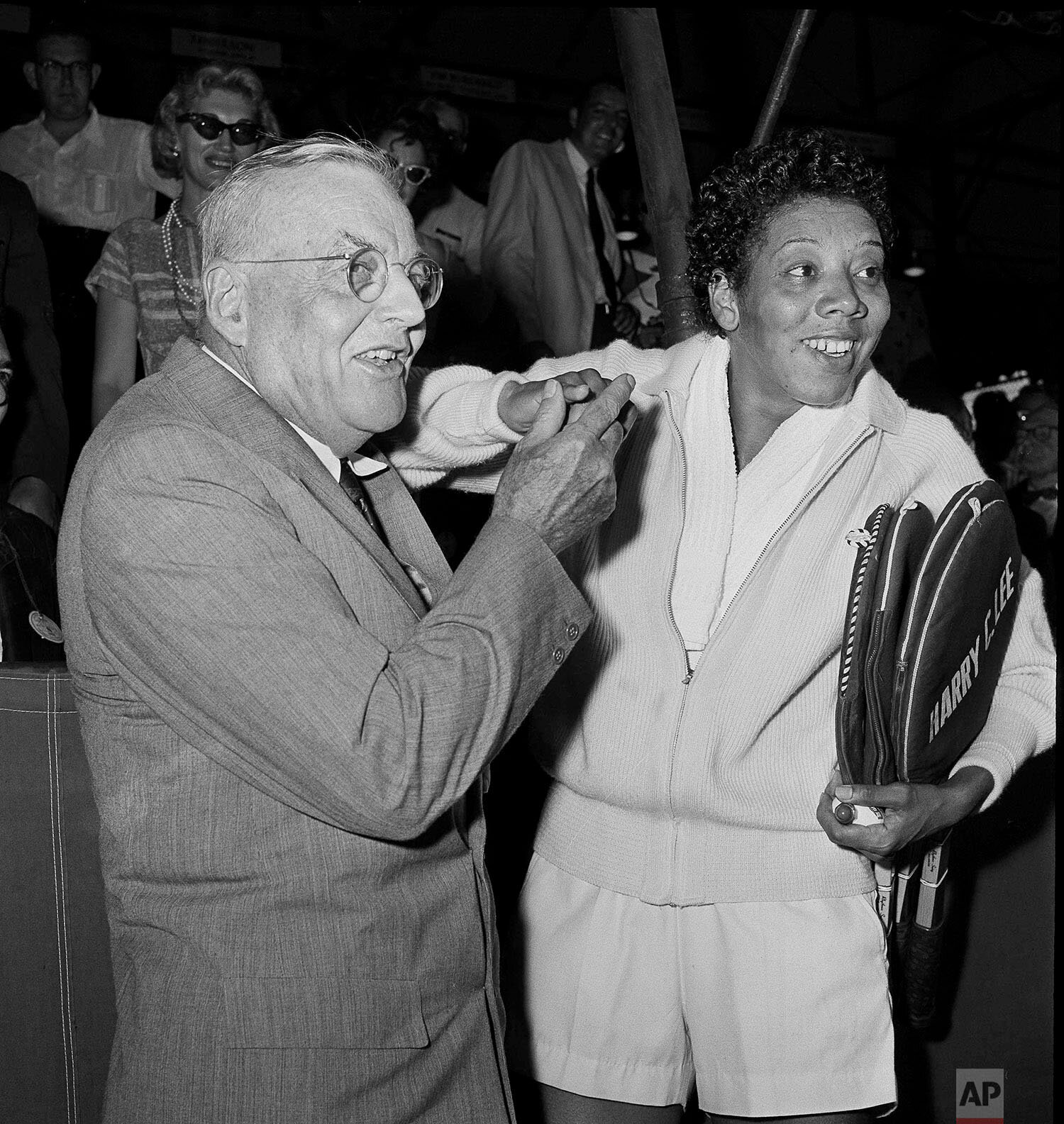  U.S. Secretary of Strate John Foster Dulles and Althea Gibson in stadium of West Side Tennis Club in New York, Sept. 7, 1958. Gibson won the U.S. Championship for the second straight year. Dulles flew in from Washimngton D.C. to make cup presentatio