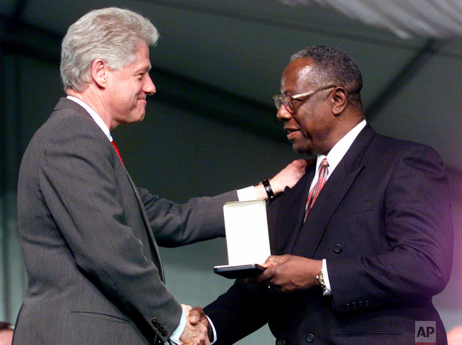  President Clinton presents baseball great Hank Aaron with a Presidential Citizens Medal during a ceremony at the White House Monday, Jan. 8, 2001. The Presidential Citizens Medal was established by President Richard Nixon in 1969 to recognize exempl