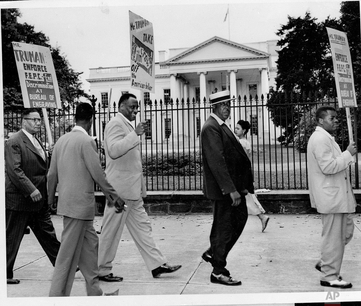  Singer Paul Robeson, third from left, pickets with others in front of the White House, Aug. 4, 1949, calling on Pres. Truman to "end discrimination at the Bureau of Engraving." (AP Photo/Henry Burroughs) 