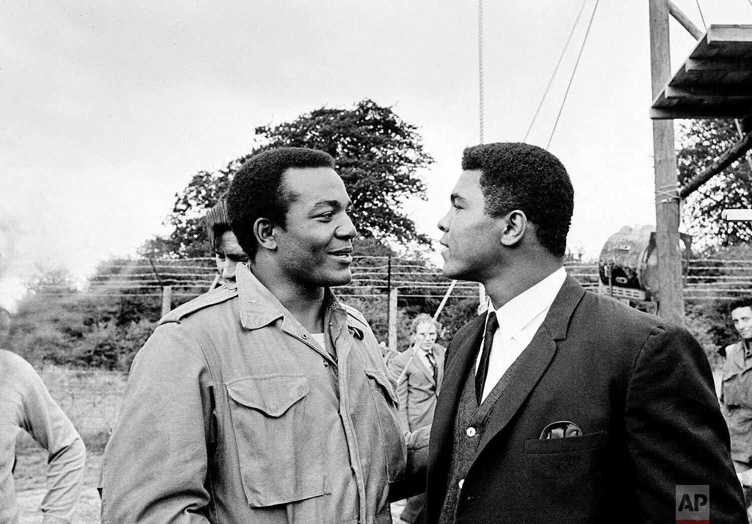  Heavyweight boxer Muhammad Ali, right, visits Cleveland Browns running back and actor Jim Brown on the film set of "The Dirty Dozen" at Morkyate, Bedfordshire, England., Aug. 5, 1966. (AP Photo) 