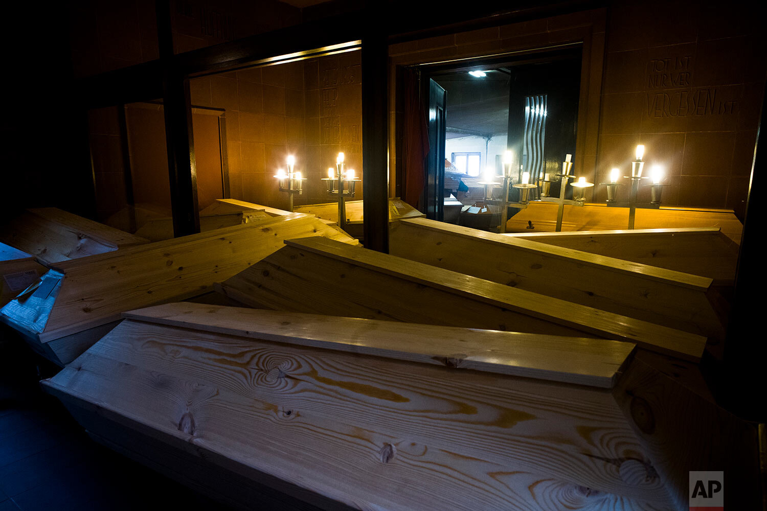  Coffins are stored in hallways of the crematorium in Meissen, Germany, Monday, Jan. 11, 2021. (AP Photo/Markus Schreiber) 