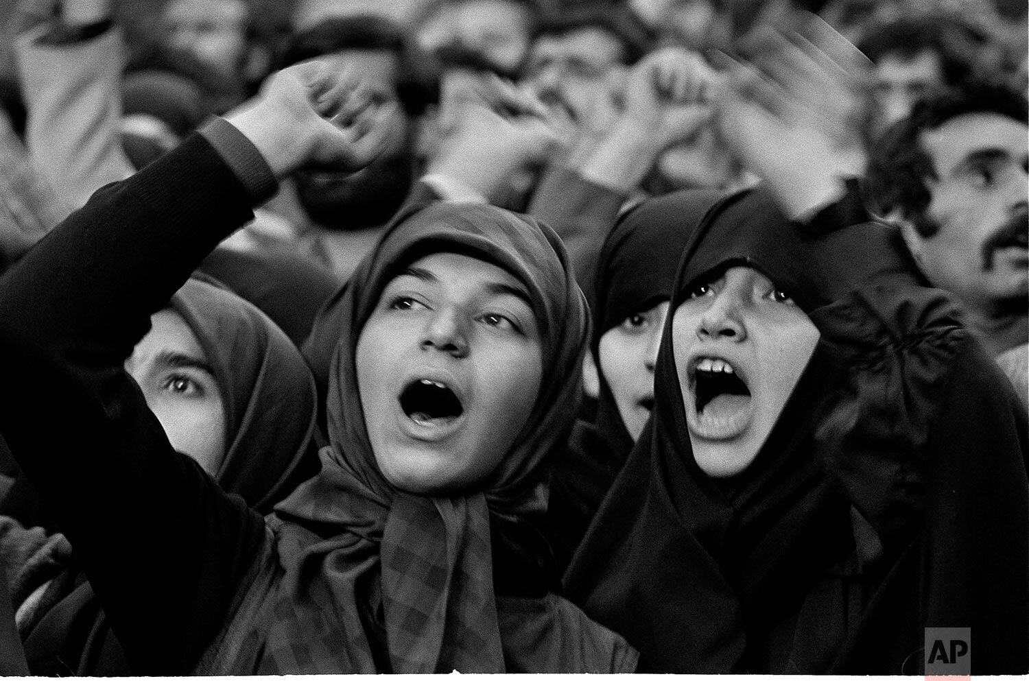  Iranian girls shout demands for President Carter to return the former Shah of Iran to Iran for trial during daily demonstrations outside the U.S. Embassy in Tehran, Nov. 24, 1979, where 50 Americans are being held hostage.  (AP Photo/Herve Merliac) 