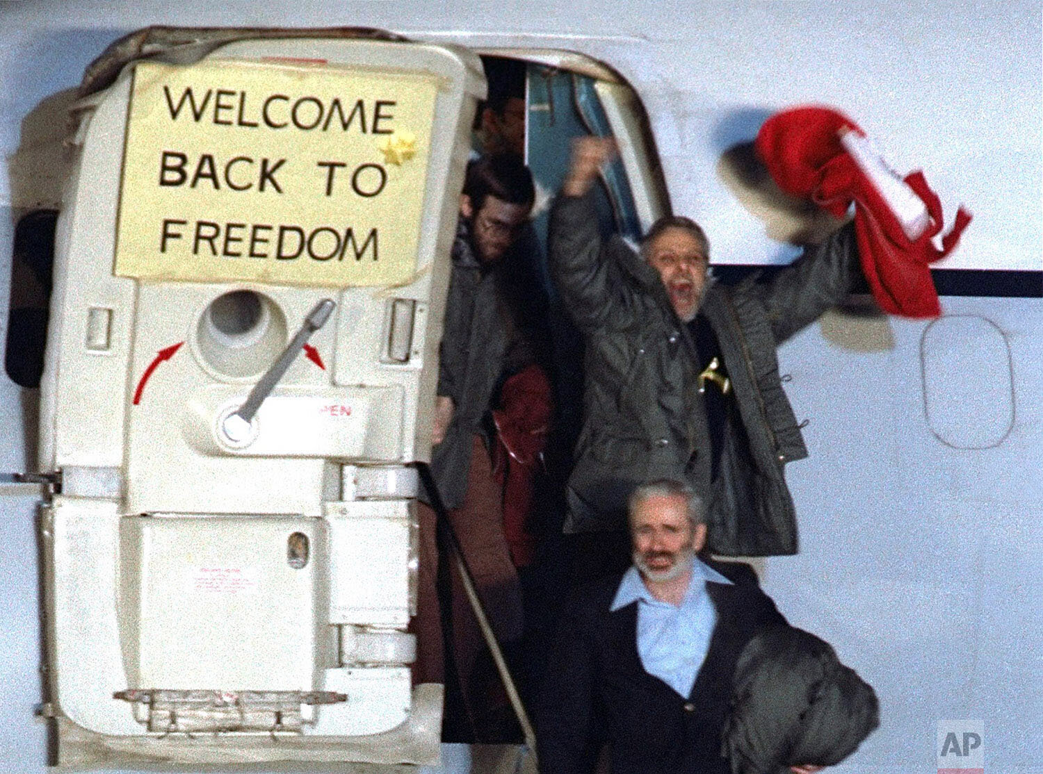  David Roeder shouts and waves as he arrives at Rhein-Main U.S. Air Force base in Frankfurt, West Germany from Algeria on January 21, 1981.  He was among 52 Americans held hostage in Iran for 444 days after their capture at the U.S. Embassy in Tehran