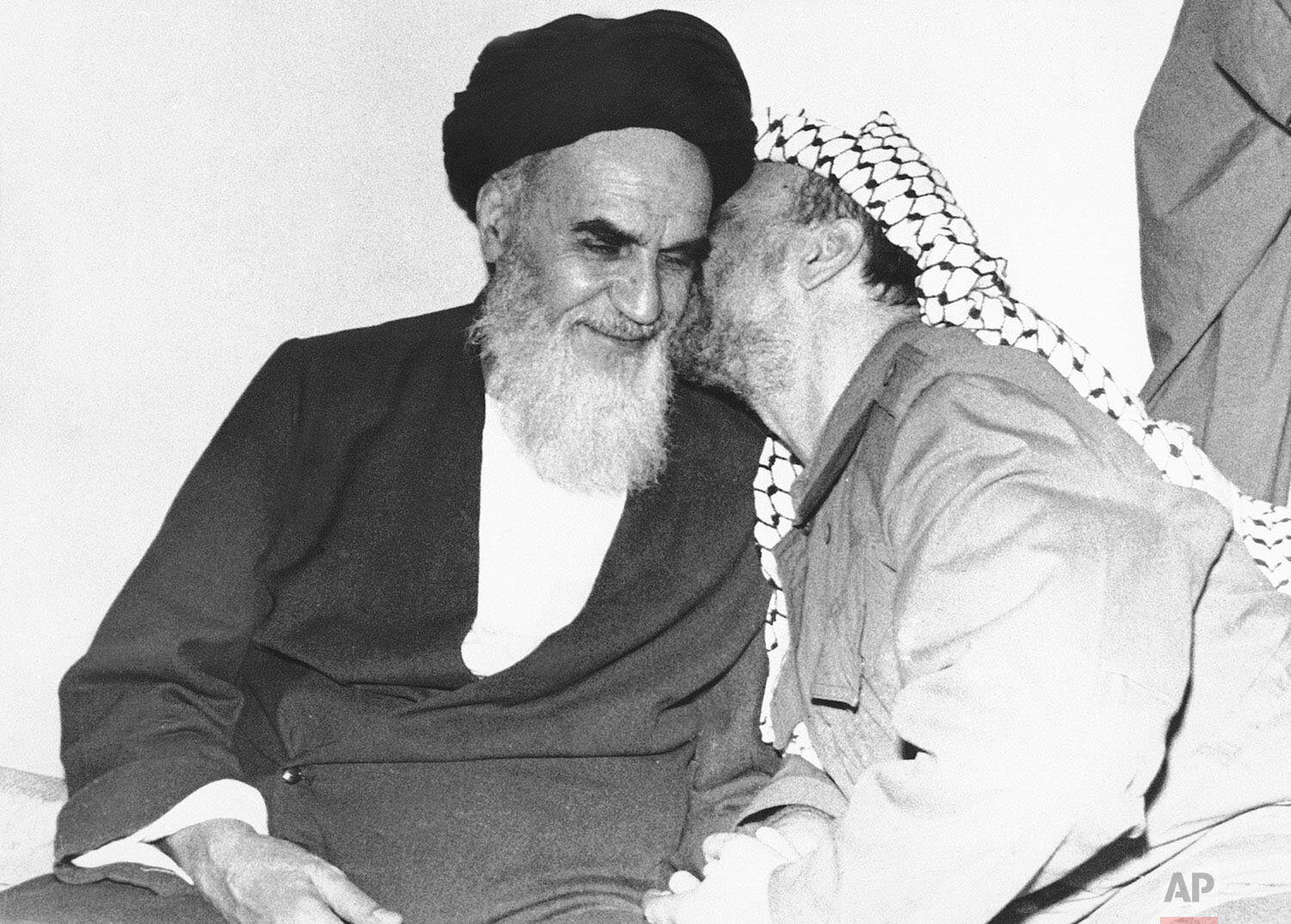  In this Feb. 18, 1979 photo, Palestinian Liberation Organization leader Yasser Arafat, right, kisses Ayatollah Ruhollah Khomeini, left, during a meeting in Tehran, Iran. (AP Photo) 