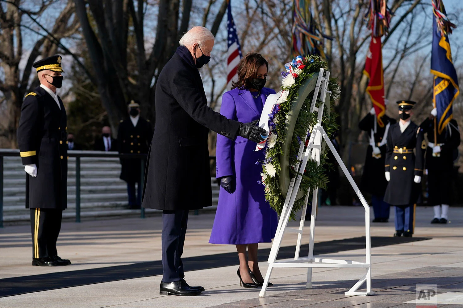 President Joe Biden and Vice President Kamala Harris participate in a wreath laying ceremony at the Tomb of the Unknown Soldier at Arlington National Cemetery in Arlington, Va. (AP Photo/Evan Vucci)
