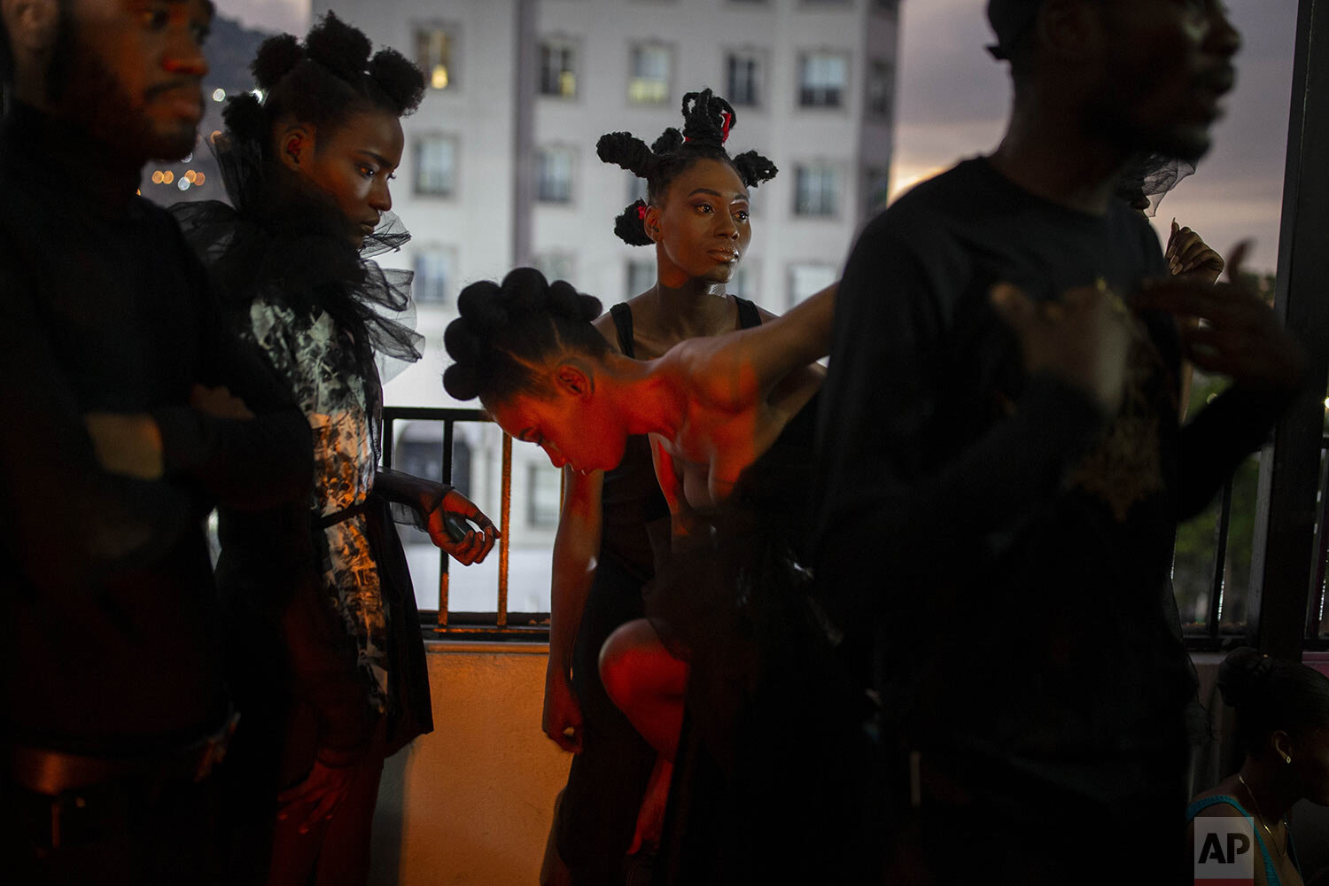  Models wear creations by Haitian designer Mackenley Darius during a fashion show promoting Haitian culture, in particular the Voodoo religion in Port-au-Prince, Haiti, Jan. 21, 2021. (AP Photo/Dieu Nalio Chery) 