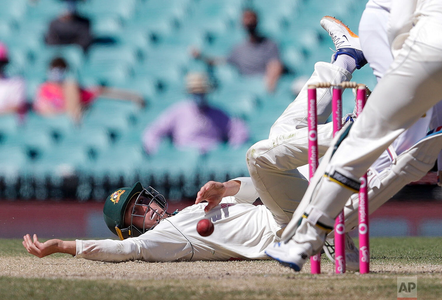  Australia's Marnus Labuschagne falls as he attempts to field the ball during play on the final day of the third cricket test between India and Australia at the Sydney Cricket Ground, Sydney, Australia, Monday, Jan. 11, 2021. (AP Photo/Rick Rycroft) 
