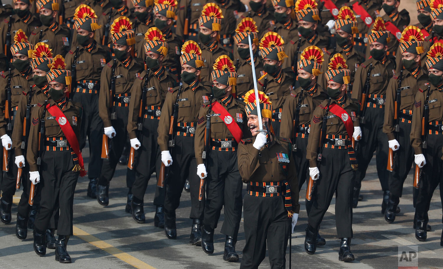  Indian army soldiers march through the ceremonial Rajpath boulevard during India's Republic Day celebrations in New Delhi, India, Tuesday, Jan. 26, 2021. AP Photo/Manish Swarup) 