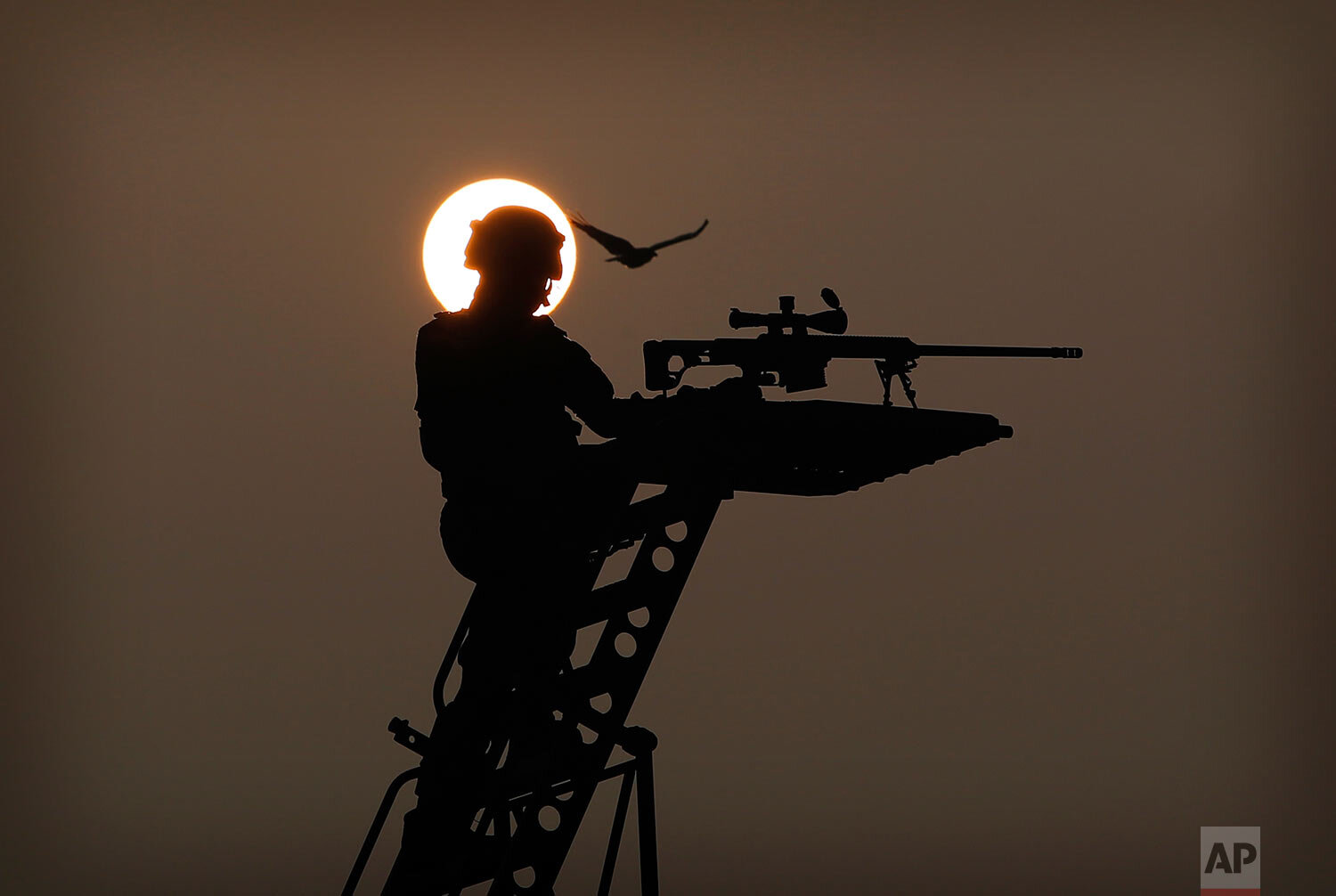  A National Security Guard soldier takes position on his tableaux during rehearsals for the upcoming Republic Day parade in New Delhi, India, Thursday, Jan. 21, 2021. (AP Photo/Manish Swarup) 