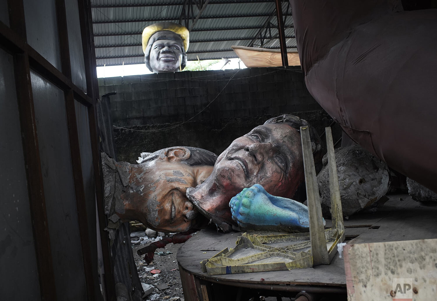  Parade float elements lay in a jumble in the Unidos de Bangu samba school workshop in Rio de Janeiro, Brazil, Feb. 9, 2021, where activity has halted due to the cancellation of Carnival amid the COVID-19 pandemic. (AP Photo/Silvia Izquierdo) 