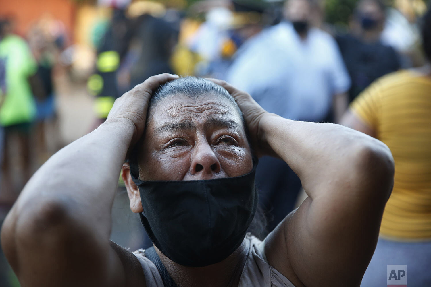  The mother of an inmate cries outside the Tacumbu jail after a prison riot in Asuncion, Paraguay, Feb. 16, 2021. (AP Photo/Jorge Saenz) 