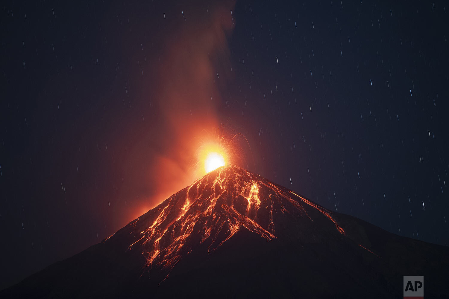  Lava flows down the Volcano of Fire in Alotenango, Guatemala, Feb. 14, 2021, covering nearby towns with ash. (AP Photo/Moises Castillo) 
