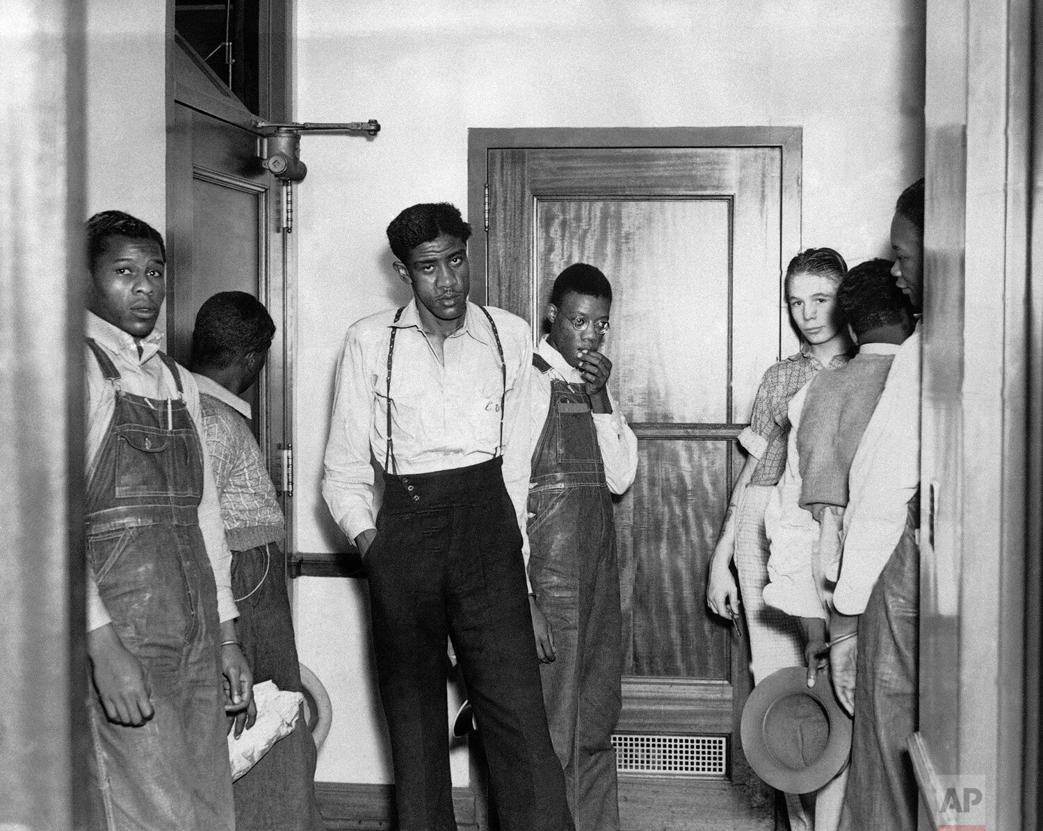  In this 1937 photo, the Scottsboro defendants go back to the cells they have occupied for six years in Birmingham, Ala., following arraignment proceedings in Decatur, Ala. (AP Photo) 