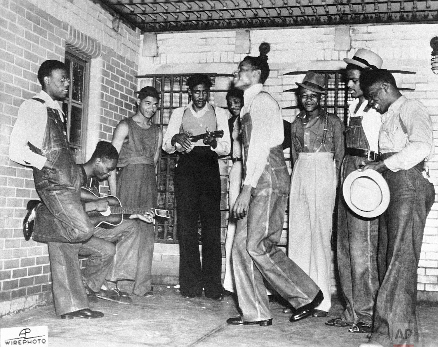  The Scottsboro Eight in jail at Birmingham, Ala., before their court appearance in July, 1937. Left to right: Olen Montgomery, Andy Wright, Eugene Williams, Charlie Weems, Patterson, Clarence Norris (dancing) Roy Wright, Ozie Powell and Willie Rober
