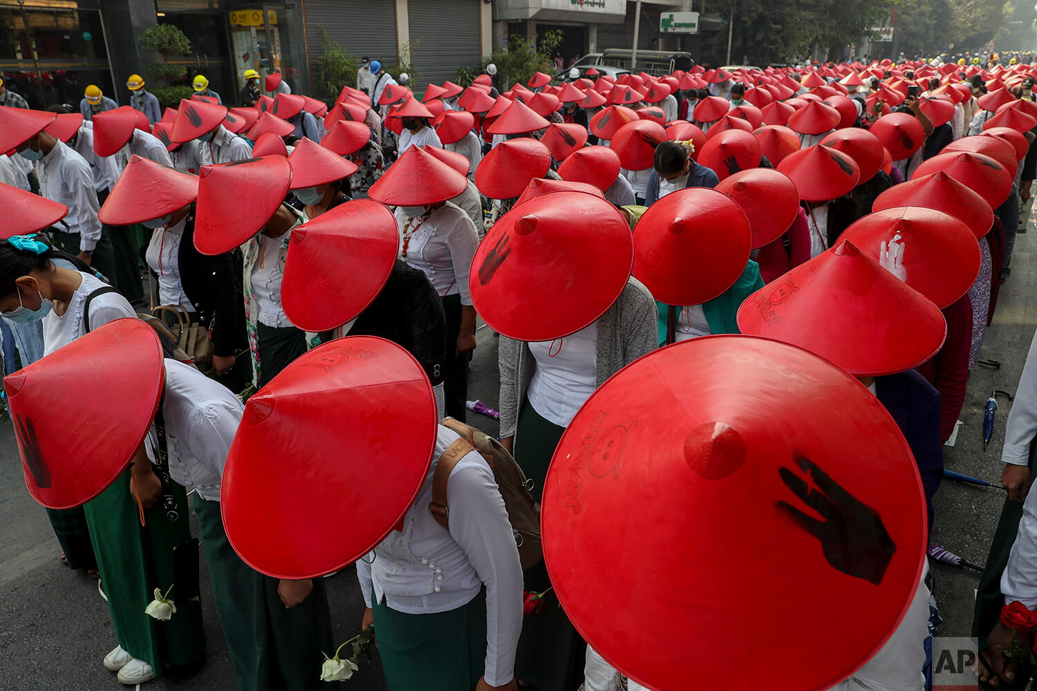  Anti-coup school teachers in their uniform and traditional Myanmar-hats participate in a demonstration in Mandalay, Myanmar, Wednesday, March 3, 2021. (AP Photo) 