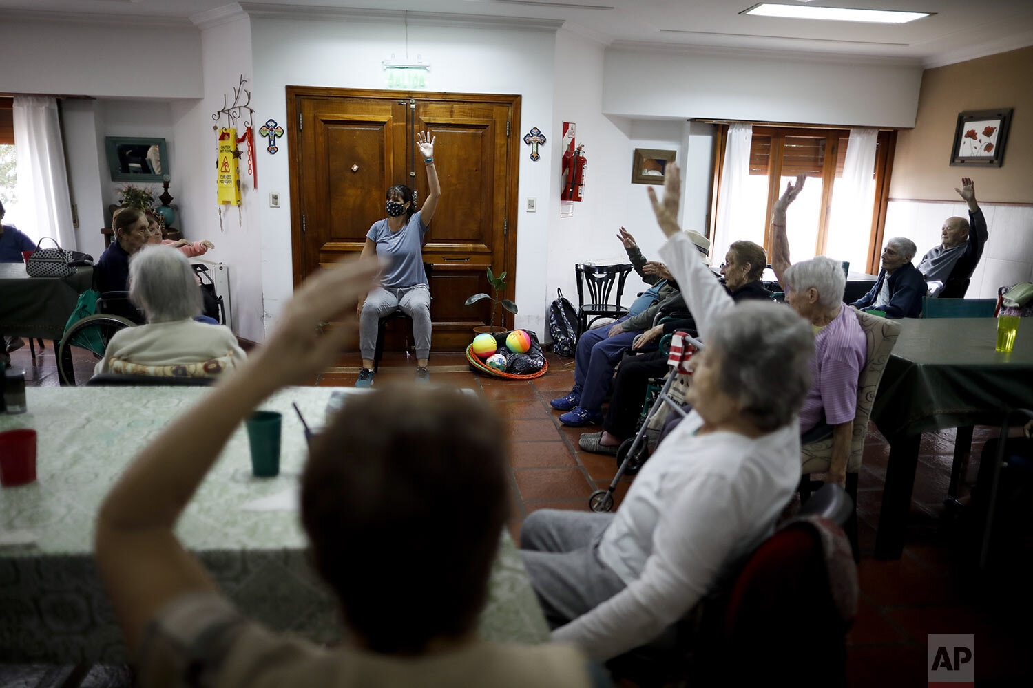  Belen Corrado leads an exercise class at Reminiscencias residence in Tandil, Argentina, Monday, April 5, 2021. (AP Photo/Natacha Pisarenko) 