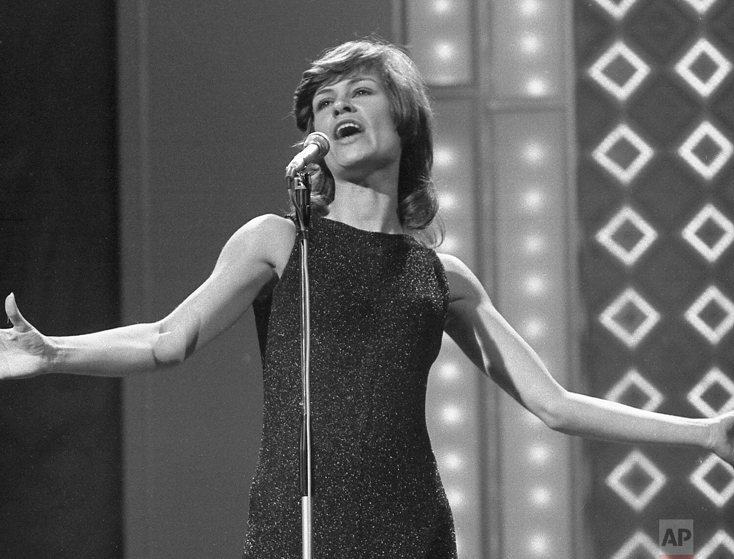  West German singer Mary Roos, performs her song "Nur die Liebe laesst dich leben" (Only Love Lets You Live) during dress rehearsal at the Usher Hall in Edinburgh, Scotland, March 25, 1972 for tonight's final of the Eurovision Song Contest. (AP Photo