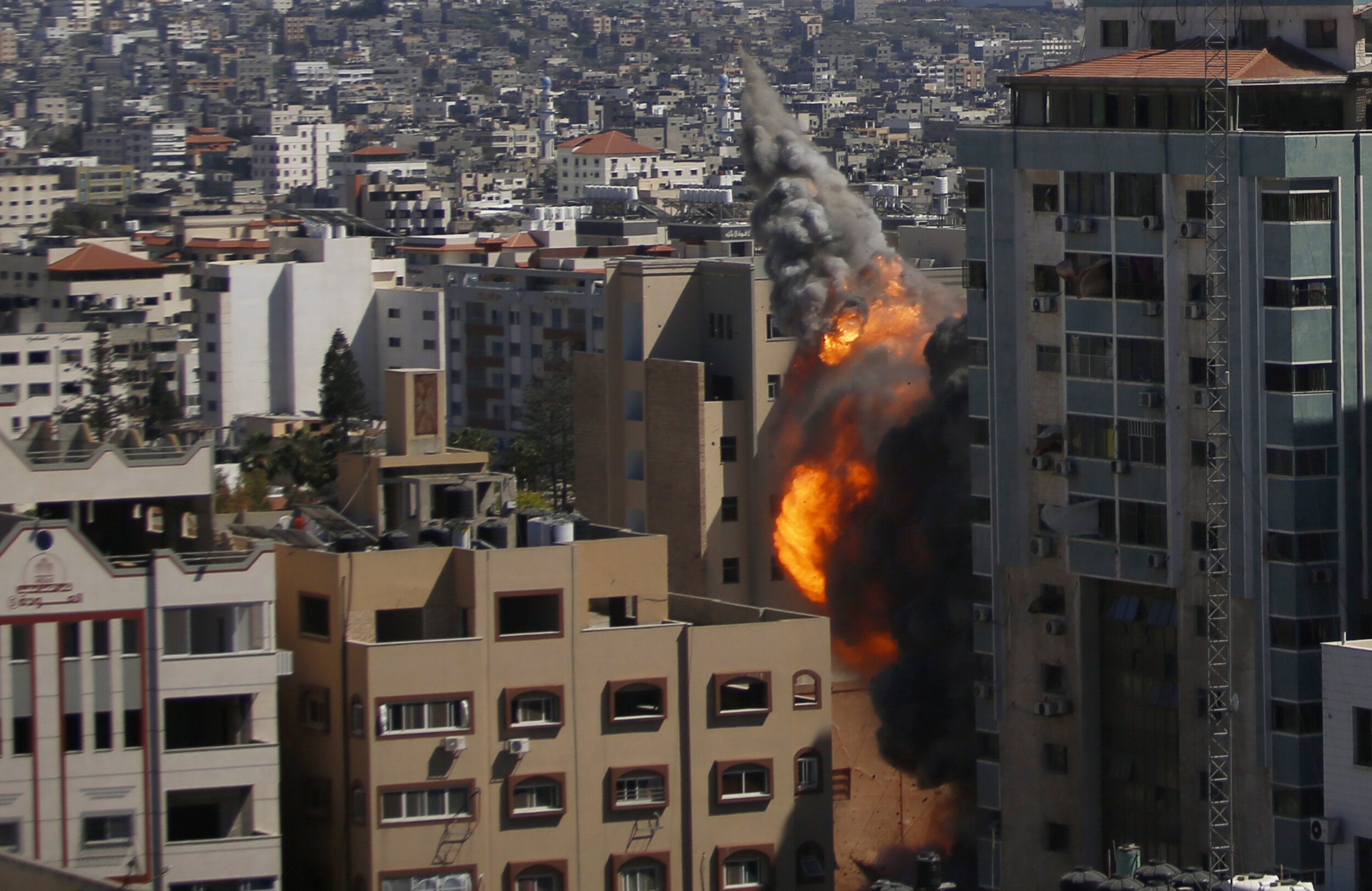  An Israeli airstrike hits the high-rise building housing The Associated Press’ offices in Gaza City, Saturday, May 15, 2021.  The airstrike Saturday came roughly an hour after the Israeli military ordered people to evacuate the building. The buildin