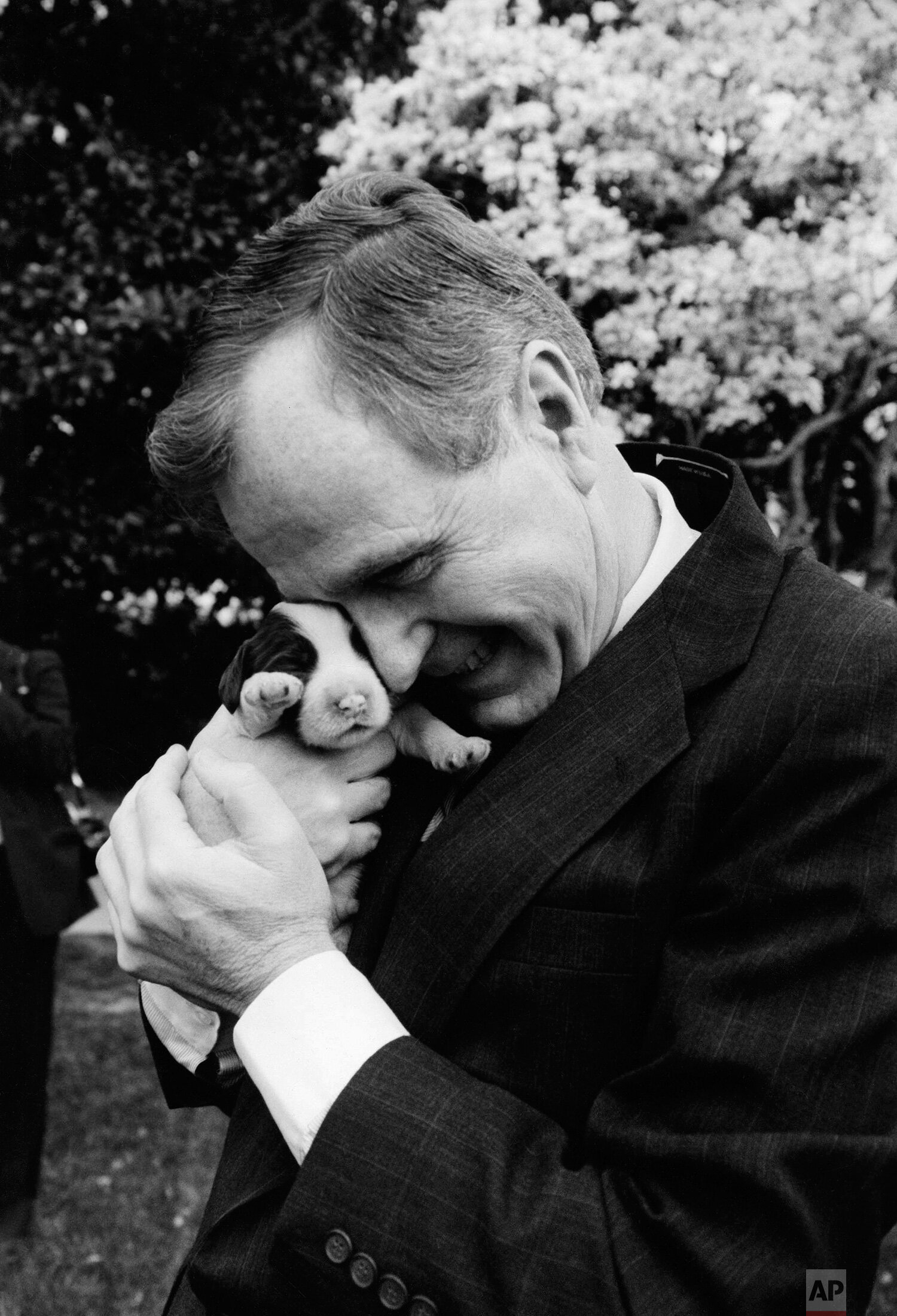  President George H.W. Bush holds one of first dog Millie's six puppies at the White House in Washington, March 29, 1989.  Mother dog Millie gave birth March 27, with First Lady Barbara Bush serving as midwife according to spokeswomen. (AP Photo/Ron 