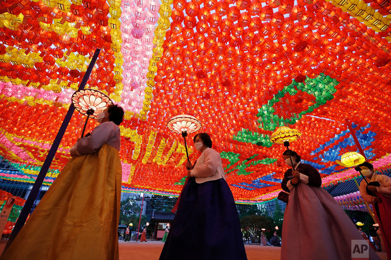  Buddhists wearing face masks, carry lanterns to celebrate for the upcoming birthday of Buddha on May 19, while maintaining social distancing as a part of precaution against the coronavirus at the Jogye temple in Seoul, South Korea, Thursday, May 6, 