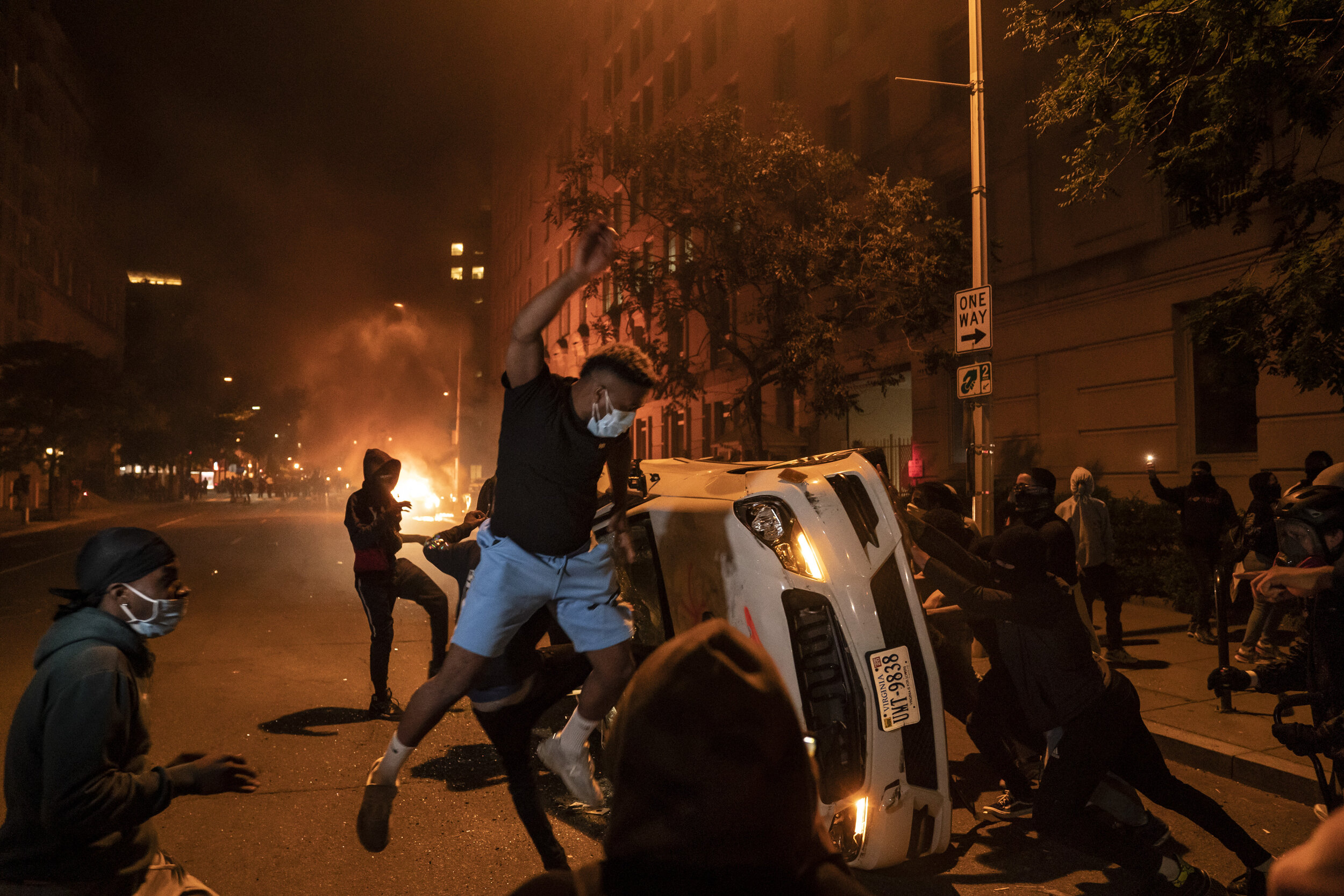  Demonstrators vandalize a car as they protest the death of George Floyd, May 31, 2020, near the White House in Washington, D.C. Floyd died after being restrained by Minneapolis police officers. (AP Photo/Evan Vucci) 