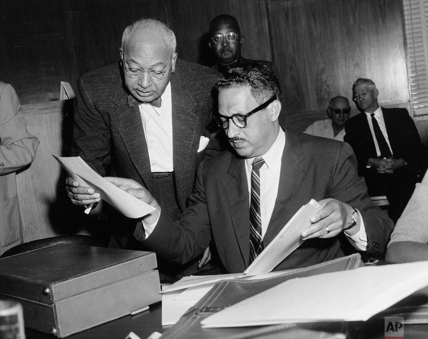  Thurgood Marshall, right, chief legal counsel of the National Association for the Advancement of Colored People, and Dallas attorney U. Simpson Tate, left, check documents during a court hearing in Tyler, Texas, September 28, 1956. They are trying t