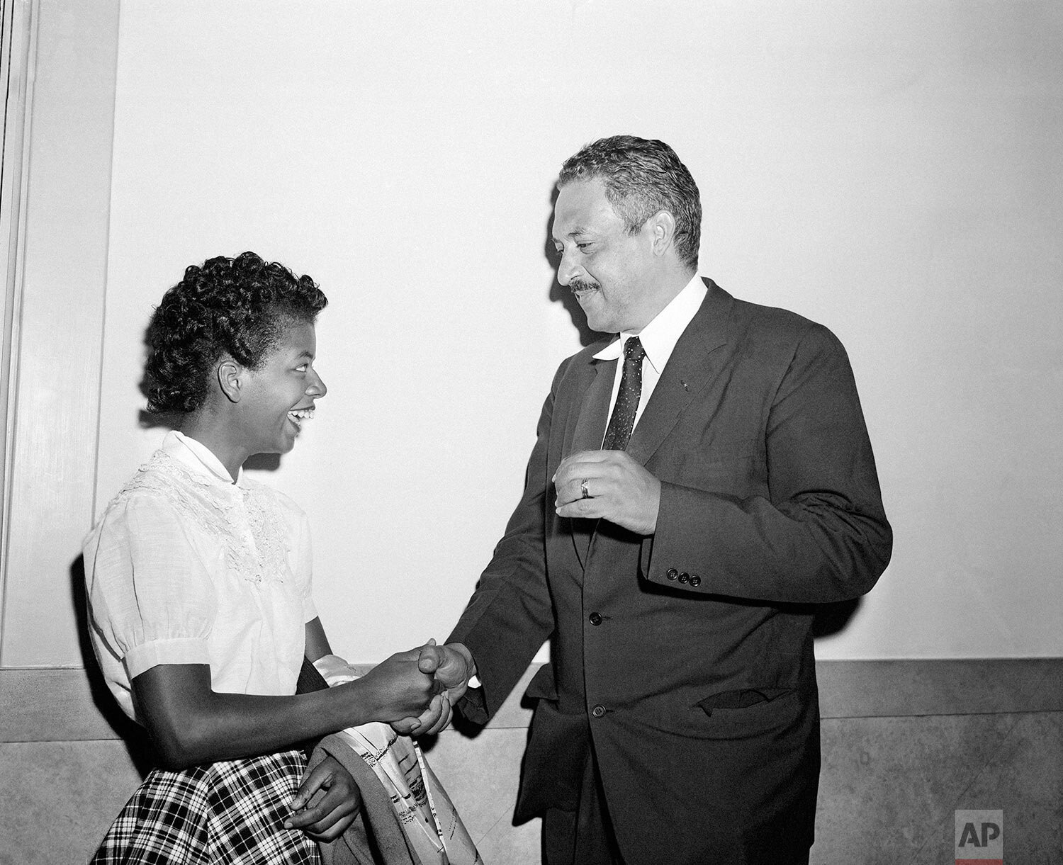  Thurgood Marshall, right, national attorney for the National Association for the Advancement of Colored People (NAACP), talks with Elizabeth Echford, 15, in the corridor of U.E. Courthouse at Little Rock, Ark., Sept. 7, 1957, where a hearing on inte