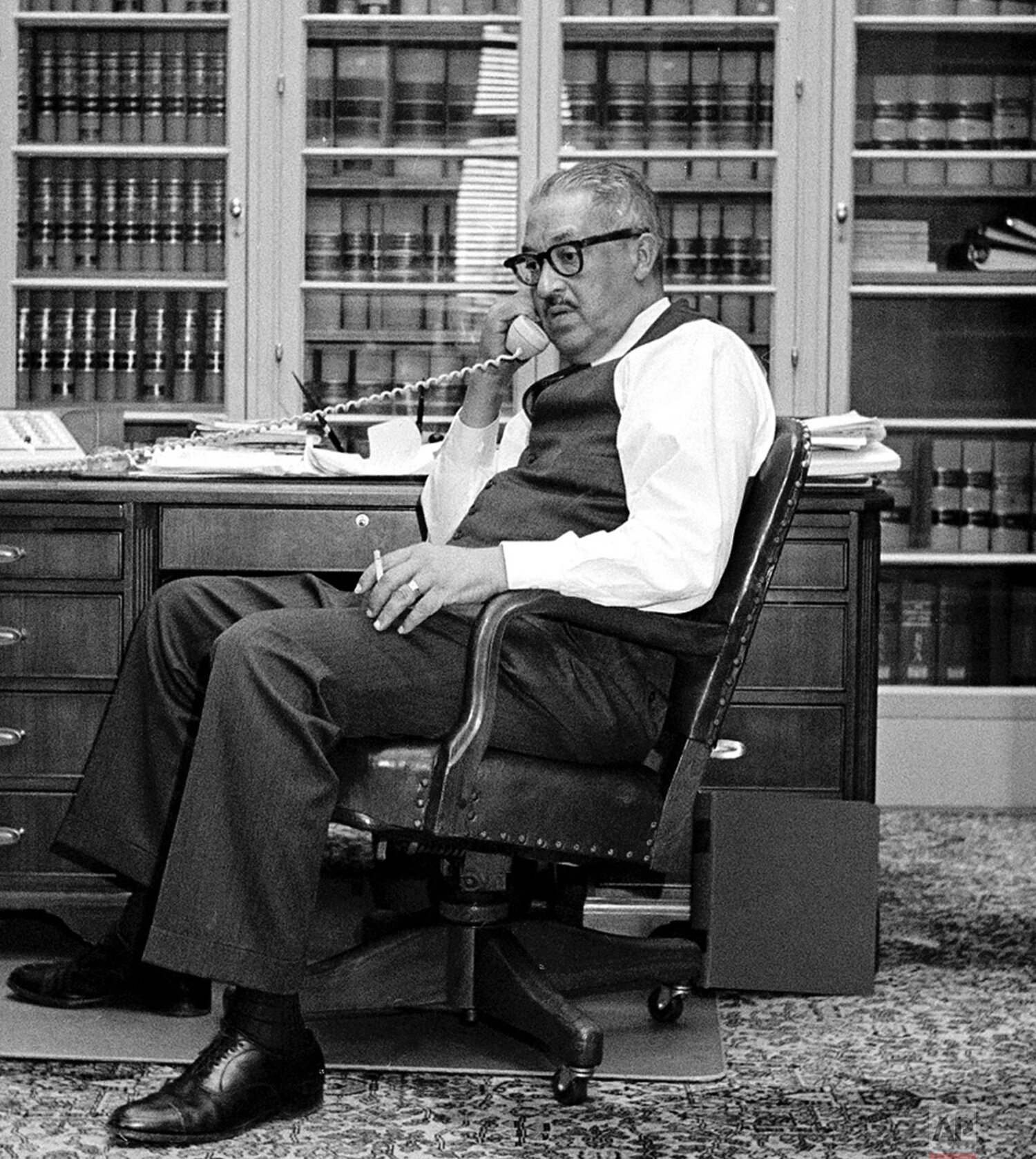  Thurgood Marshall, the new Solicitor General of the United States, talks on the phone in his Department of Justice office in Washington, Dec. 9, 1965.  Marshall, grandson of a slave, gave up a lifetime tenure as a Court of Appeals judge to become th
