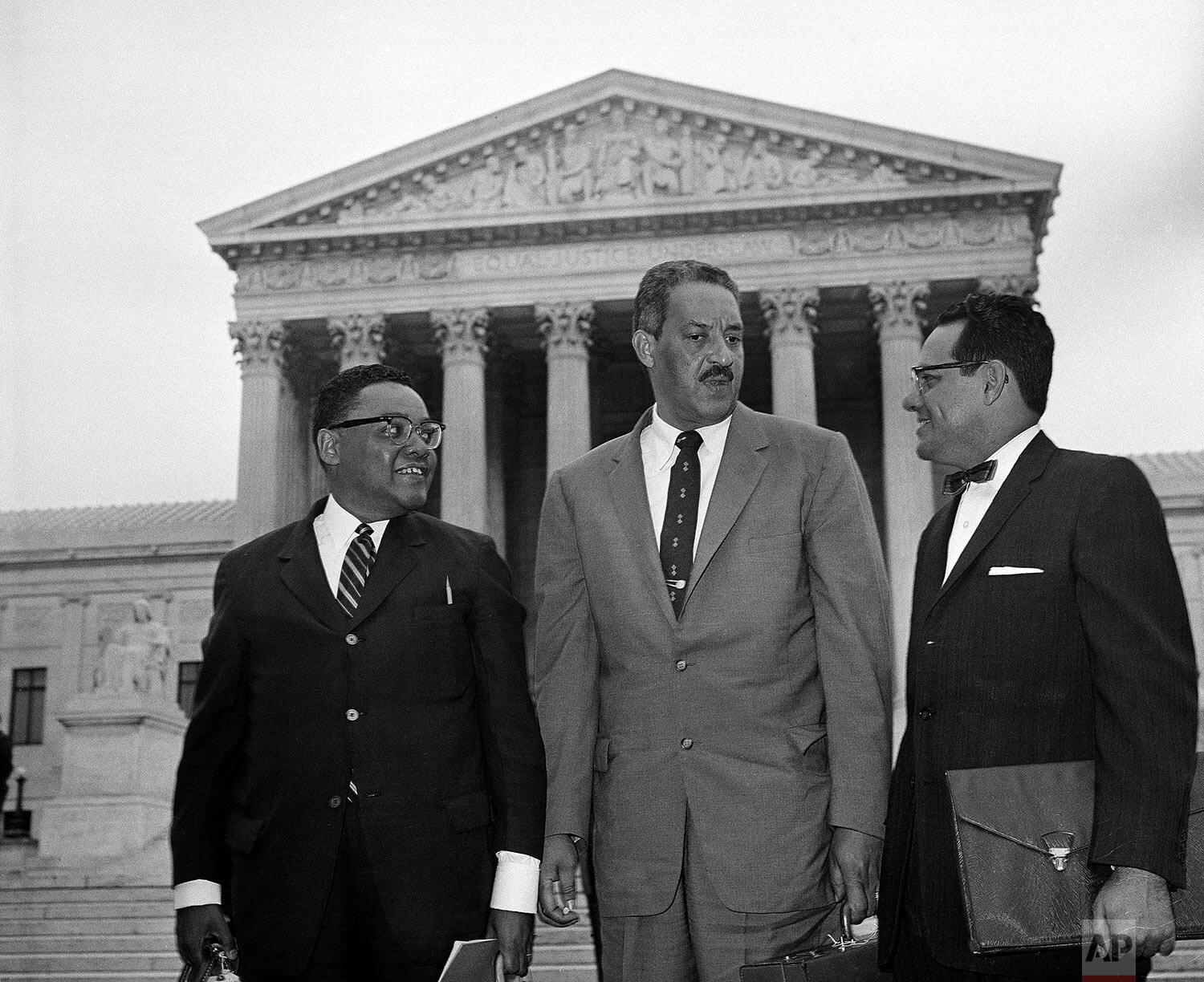  Three attorneys for the National Association for the Advancement of Colored People pose outside the Supreme Court in Washington, D.C., after arriving, Aug. 28, 1958, for the extraordinary session of High Tribunal on integration. From left: William T