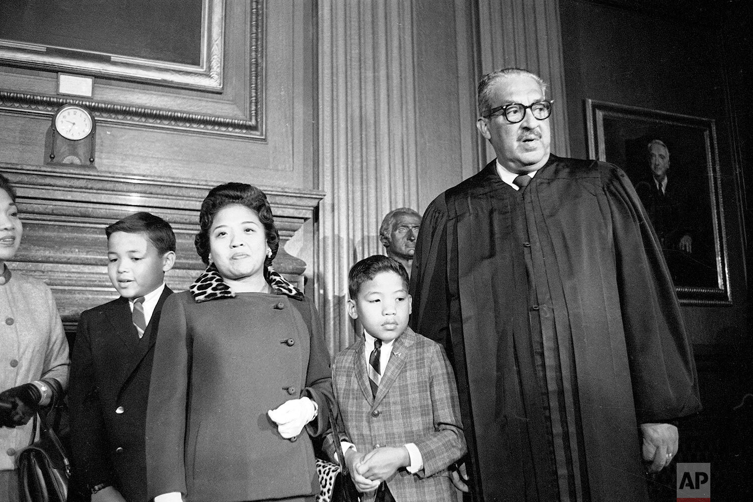  Supreme Court Justice Thurgood Marshall's family is at hand to watch him take his seat at the court for the first time, Oct. 2, 1967.  From left to right: sons Thurgood, Jr., 11, John, 9, wife Cecilia Suyat, and the Justice.  (AP Photo/Henry Griffin