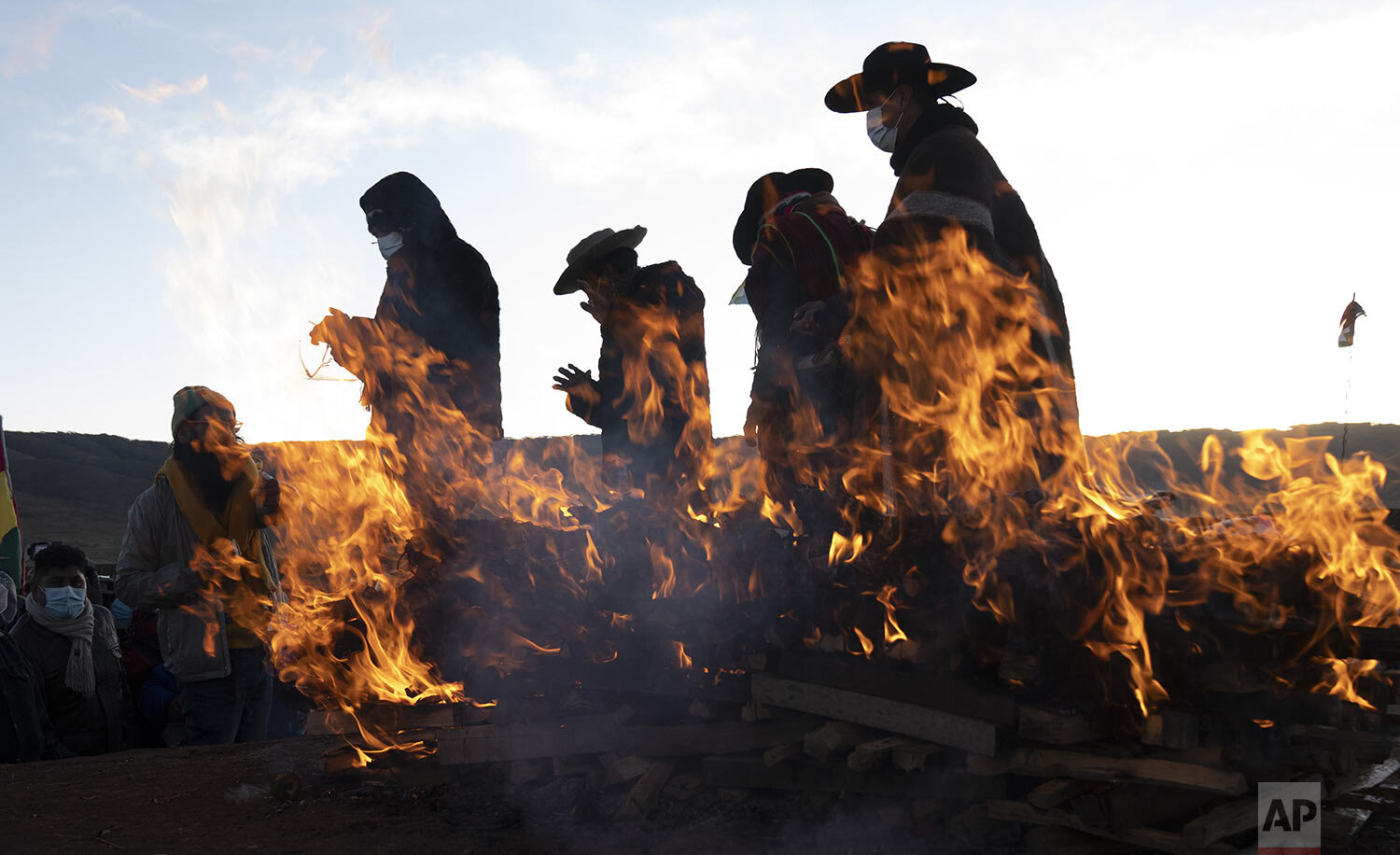  Aymara Indigenous religious leaders finish a new year's ritual in the ancient city of Tiwanaku, Bolivia, June 21, 2021. The Aymara are celebrating the Andean New Year of 5,529 as well as the Southern Hemisphere's winter solstice. (AP Photo/Juan Kari