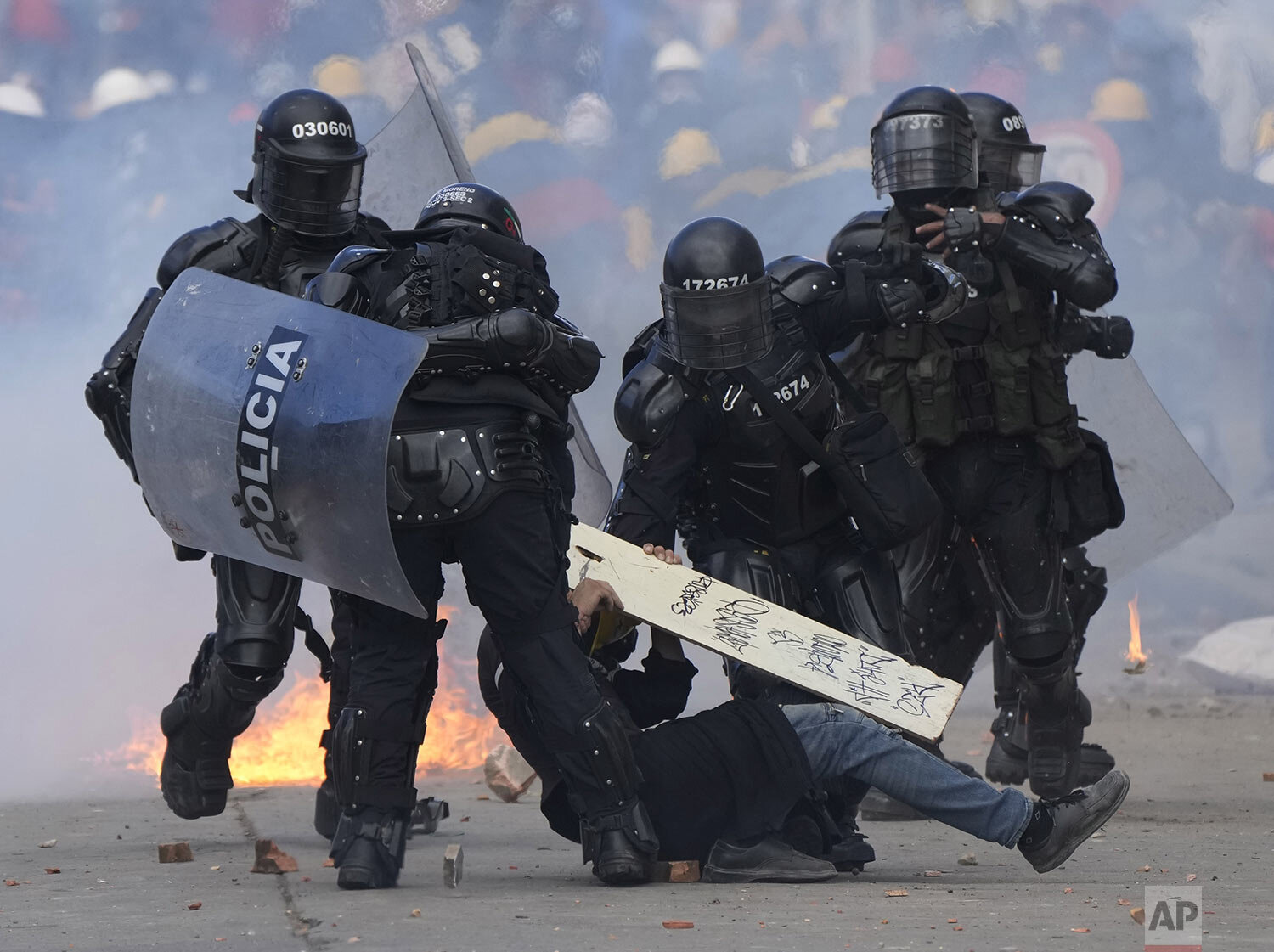  Police detain a man during continuing anti-government protests triggered by proposed tax increases on public services, fuel, wages and pensions in Bogota, Colombia, June 28, 2021. (AP Photo/Fernando Vergara) 