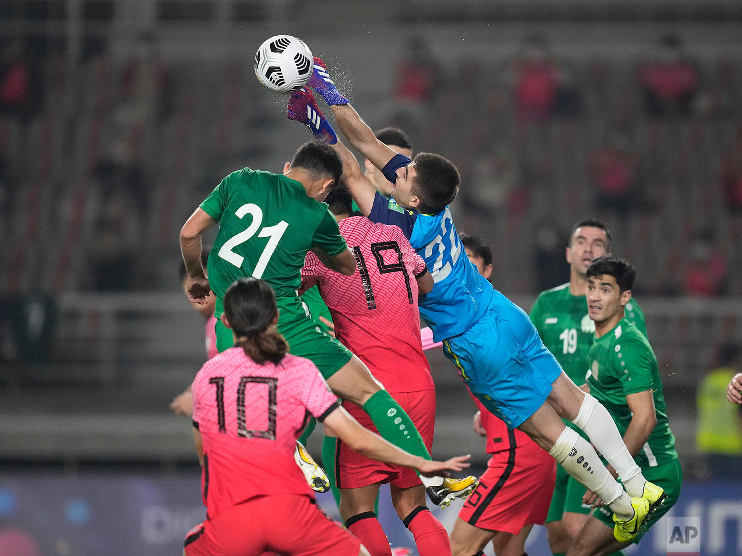  Turkmenistan's goalkeeper Charyyev Rasul punches the ball during their Asian zone Group H qualifying soccer match against South Korea for the FIFA World Cup Qatar 2022 at Goyang stadium in Goyang, South Korea, Saturday, June 5, 2021. (AP Photo/Lee J