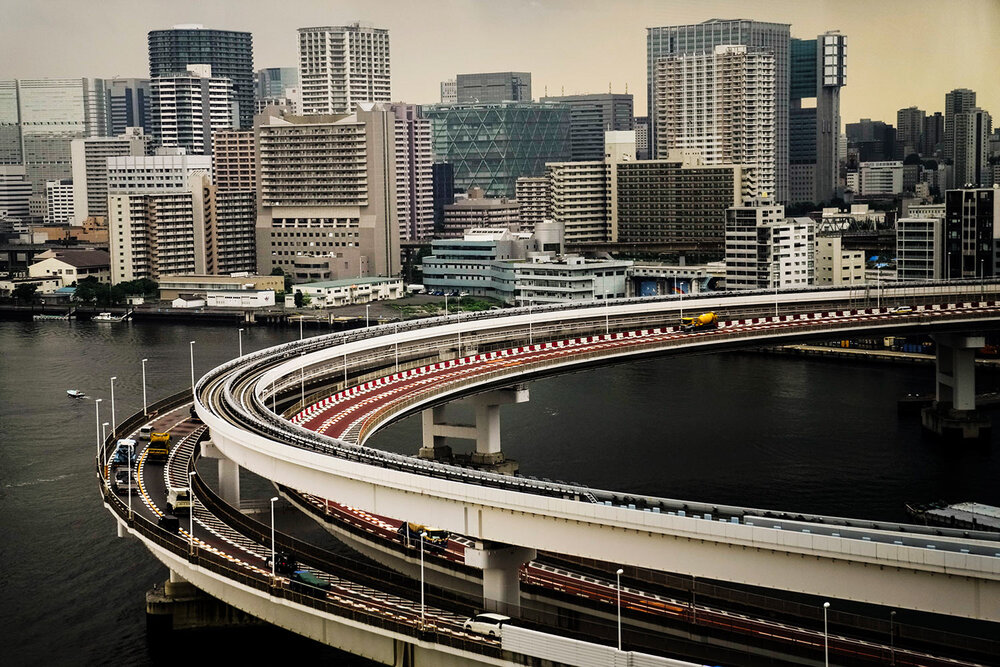  Motorists drive along a spiral ramp onto the Rainbow Bridge, Tuesday, July 13, 2021, in Tokyo. (AP Photo/Jae C. Hong) 