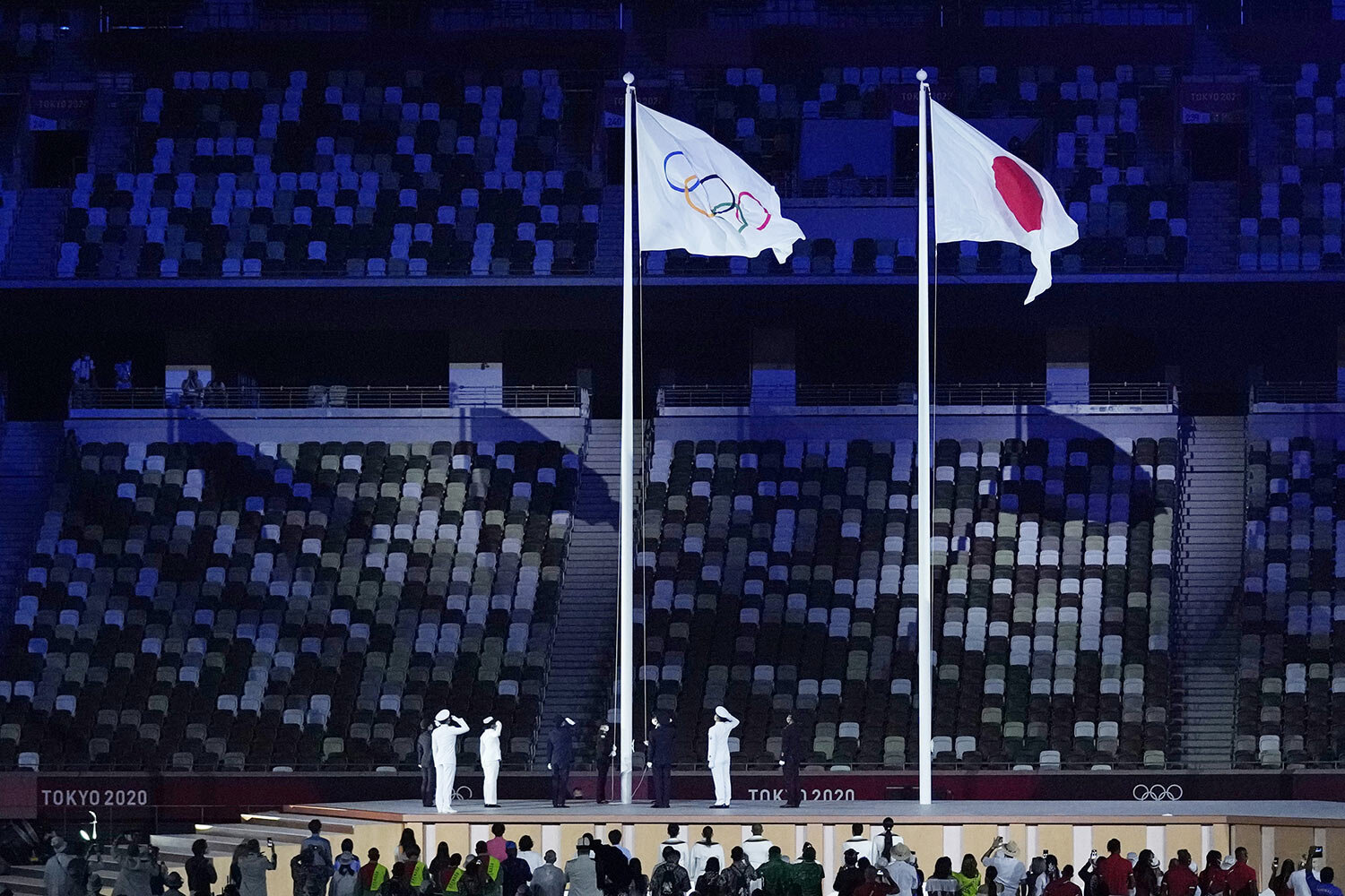  The Olympic flag is raised during the opening ceremony in the Olympic Stadium at the 2020 Summer Olympics, Friday, July 23, 2021, in Tokyo, Japan. (AP Photo/Kirsty Wigglesworth) 