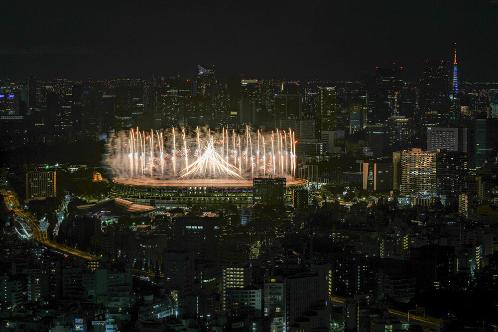  Fireworks illuminate over National Stadium during the opening ceremony of the 2020 Tokyo Olympics, Friday, July 23, 2021, in Tokyo. (AP Photo/Kiichiro Sato) 