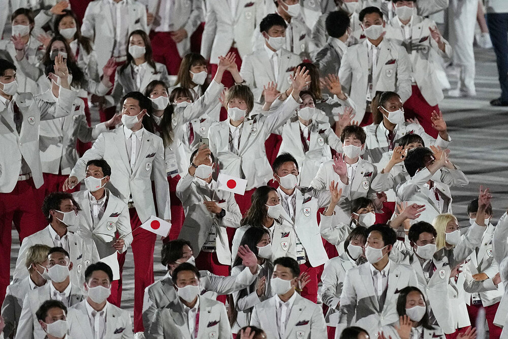  Athletes from Japan walk during the opening ceremony in the Olympic Stadium at the 2020 Summer Olympics, Friday, July 23, 2021, in Tokyo, Japan. (AP Photo/David J. Phillip) 