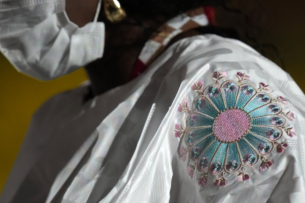  A Team member of Gambia walks during the opening ceremony in the Olympic Stadium at the 2020 Summer Olympics, Friday, July 23, 2021, in Tokyo, Japan. (AP Photo/Petr David Josek) 