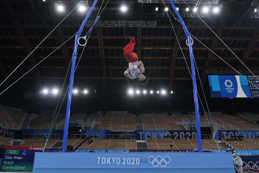  Carlos Edriel Yulo, of Philippines, performs on the rings during the men's artistic gymnastic qualifications at the 2020 Summer Olympics, Saturday, July 24, 2021, in Tokyo. (AP Photo/Gregory Bull) 