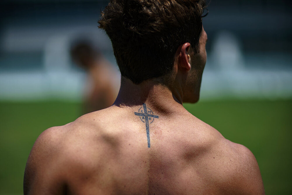  A tattoo decorates the back of Argentina's Rodrigo Isgro as he walks off the field after a men's rugby sevens practice at the Tokyo 2020 Olympics, in Tokyo, Friday, July 23, 2021. (AP Photo/David Goldman) 