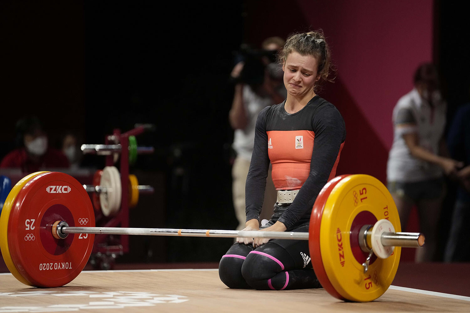  Nina Sterckx of Belgium weeps after an unsuccessful attempt as she competes in the women's 49kg weightlifting event, at the 2020 Summer Olympics, Saturday, July 24, 2021, in Tokyo, Japan. (AP Photo/Luca Bruno) 